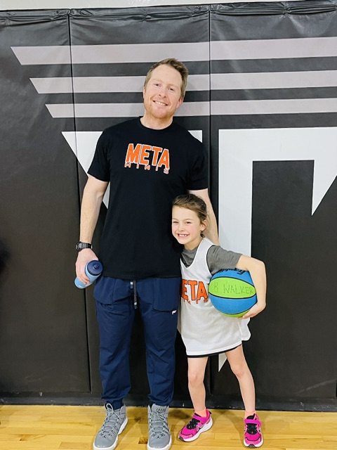 Brad Walker with his daughter after a youth basketball game