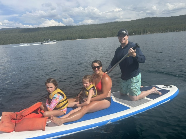 Brad Walker paddleboarding on an Idaho mountain lake