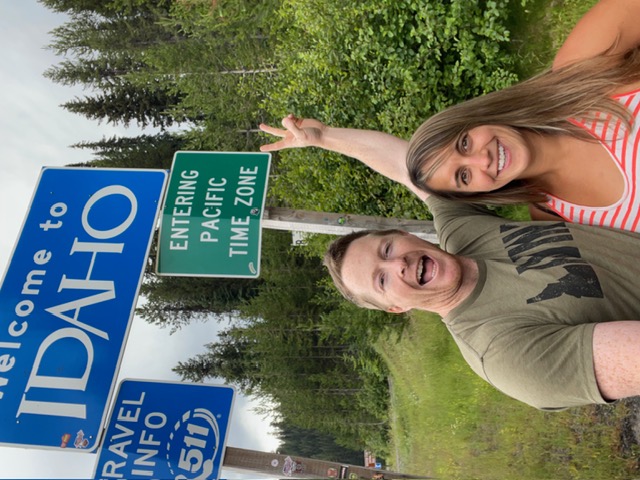 Brad Walker and his wife at the Welcome to Idaho state line sign